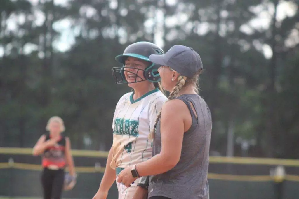 Coach Cara and Haley at first base in Apex, NC on July 19, 2025